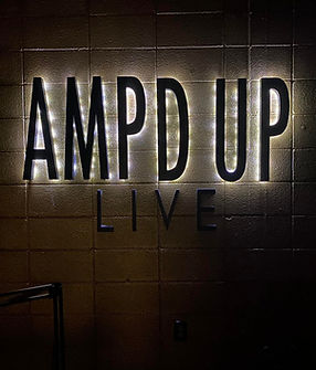 ampd up live lights gold wall text