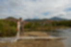 A Couple Elopes on a Beach Surrounded By Mountains in Upstate New York's Adirondack Mountains