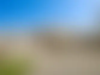 Luxury architecture in Texas Hill Country featuring modern limestone façade, clean rectangular geometry, and integrated window design — custom luxury home concept aligned with Khamila Design House architectural services in San Antonio.