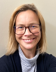 smiling lesbian therapist in los angeles, warm colors, glasses