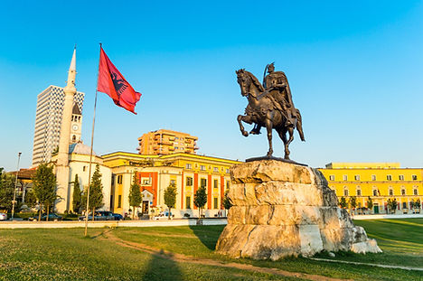 Skanderbeg-square-with-flag-Skanderbeg-monument-and-The-Et-hem-Bey-Mosque-in-the-center-of