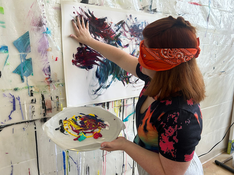 Painting blindfolded with her bare hands, a woman explores tactile self-expression through Louisville wellness coaching.