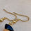 Miniature : Boucles d'oreilles avec de l'obsidienne, de la cornaline et un chapeau