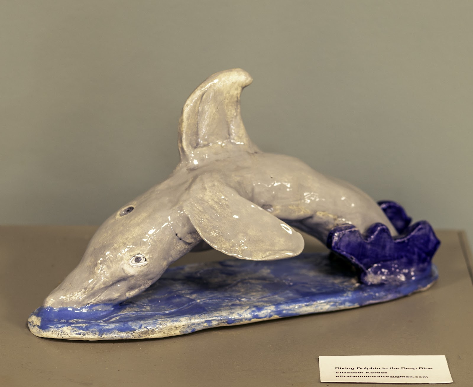 Diving Dolphin in the Deep Blue