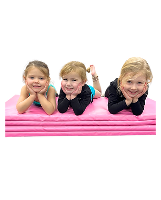 Three preschool friends lying on an acrobatics mat