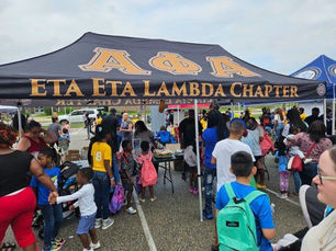 Brothers Participate in the 4th Annual Book Bag Giveaway