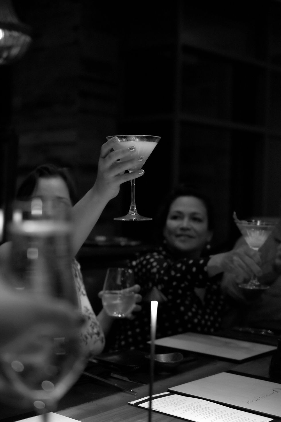 Glasses raised in celebration