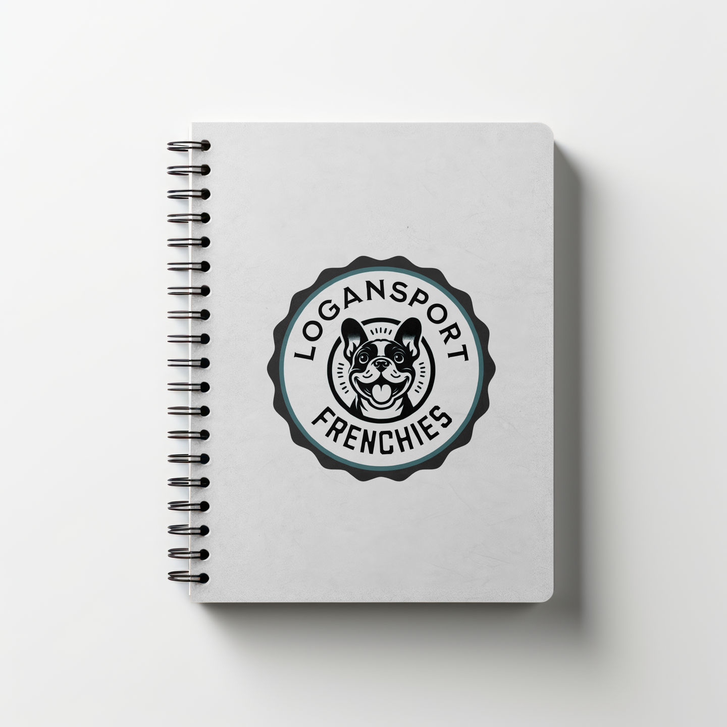 a branded spiral bound book with a logo for "Logansport Frenchies" featuring a scalloped badge and french bulldog graphic