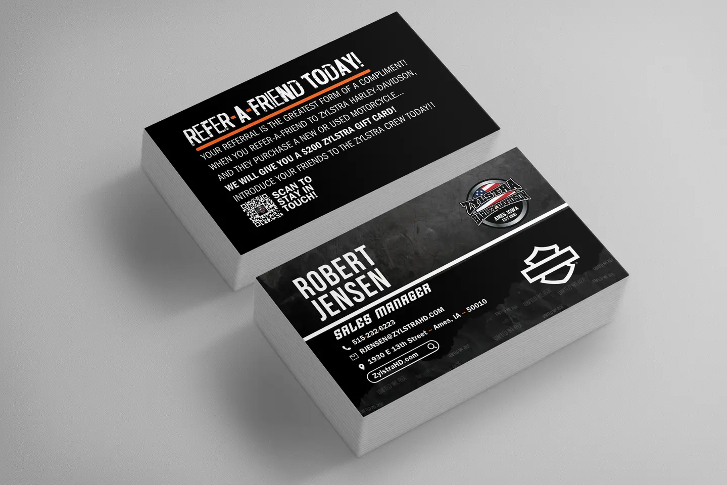 business cards for a powersports company featuring multiple logos and a qr code