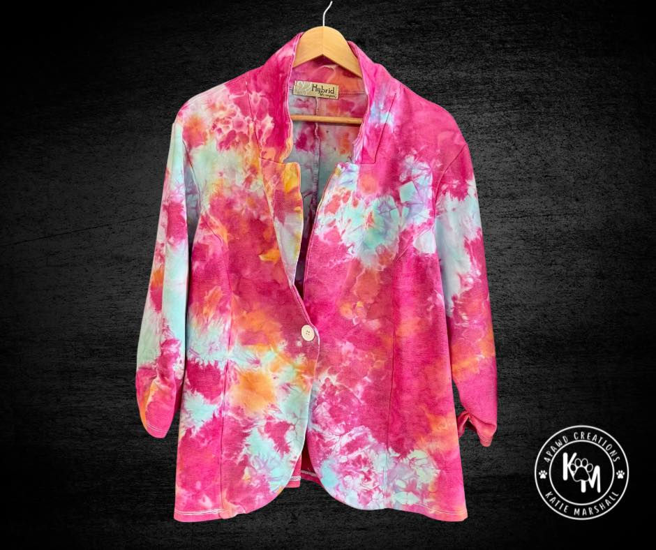 Pink and blue ice dyed blazer on wooden hanger.