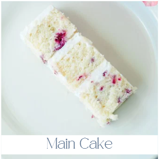 Kitchen cake slice showing multiple layers with raspberry filling and buttercream, demonstrating quality difference from sheet cakes