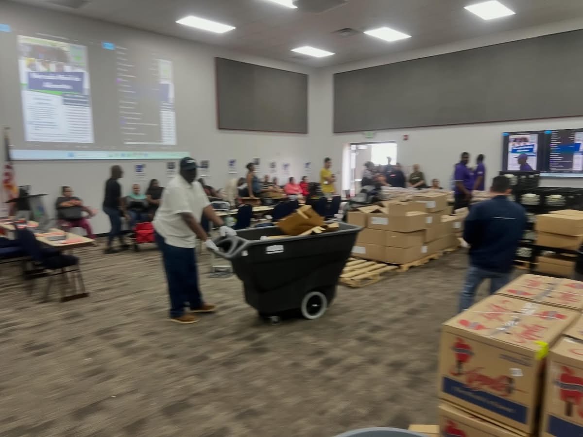 Community outreach team preparing food boxes and supplies