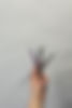 hand holding three calligraphy pens