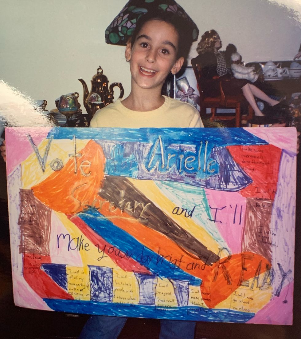 young artist with handwritten sign