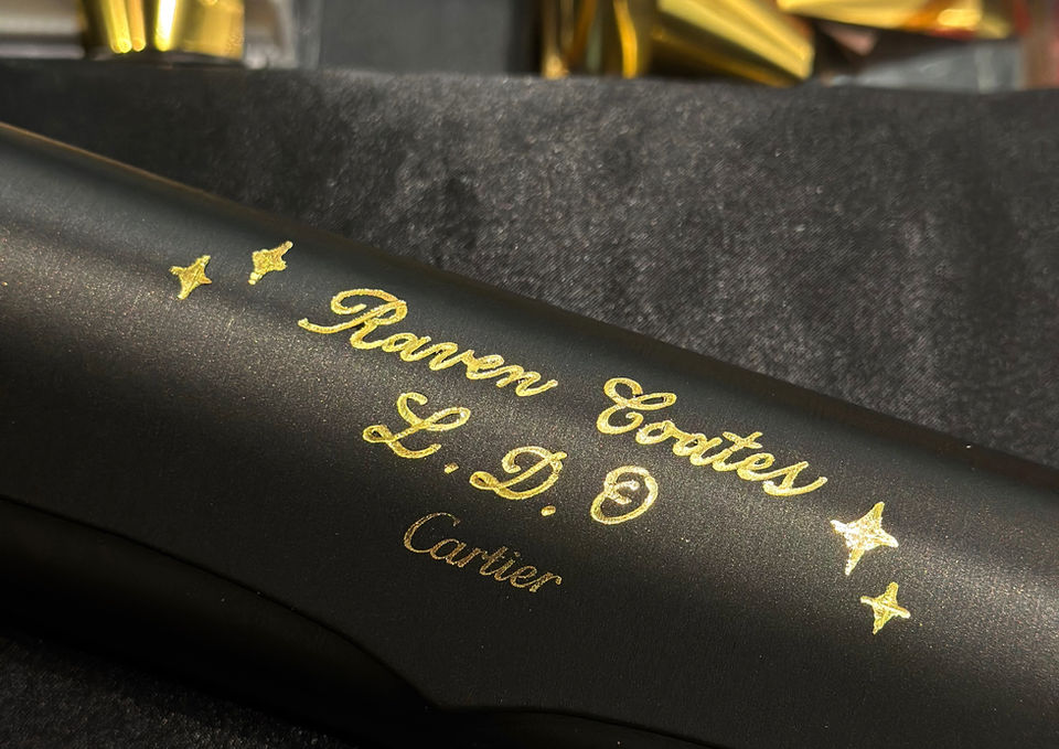 Branded live calligraphy for Cartier's in-store event, writing guest names on eyeglasses cases with hot foiling technique