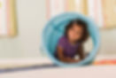 Girl playing in tunnel