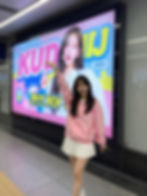 KPop Idol infront of a billboard