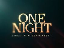 This image depicts a still from the One Night promo, with the title text "One Night" floating in front of a dark background, as the text moves in and out of focus. Beneath the title is text which reads "Streaming September 1".