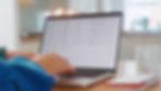 working-on-spreadsheets-at-home-office-in-modern-kitchen-SBI-350051848.jpg