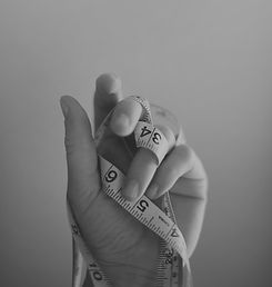person's%20left%20hand%20wrapped%20by%20tape%20measure_edited.jpg