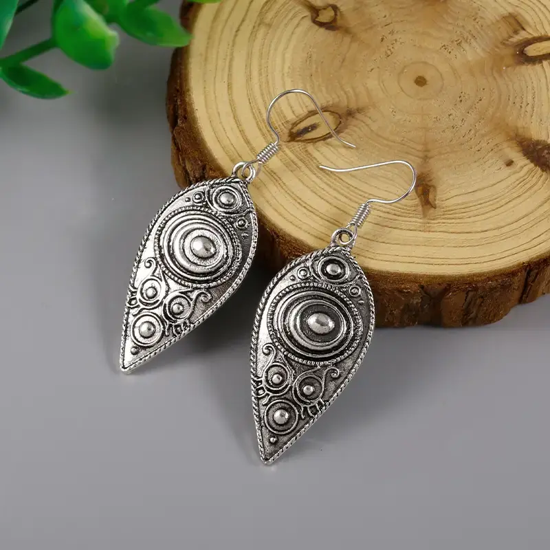 Thumbnail: Retro Ethnic Vintage Leaf Shaped Carved Round Pattern Dangle Earrings