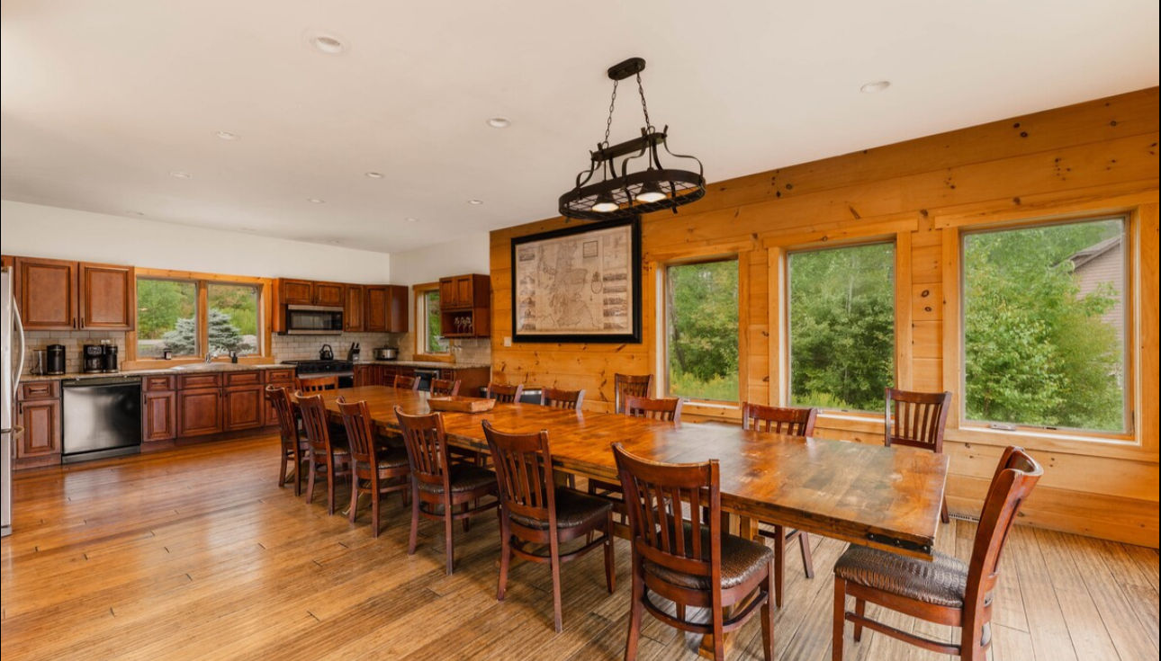 Spacious retreat kitchen with long dining counter and lake views