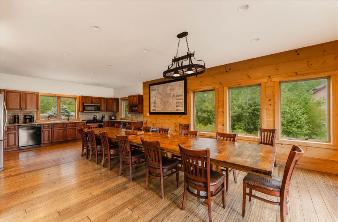 Spacious retreat kitchen with long dining counter and lake views
