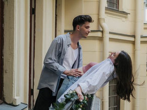 Couple hugging on balcony