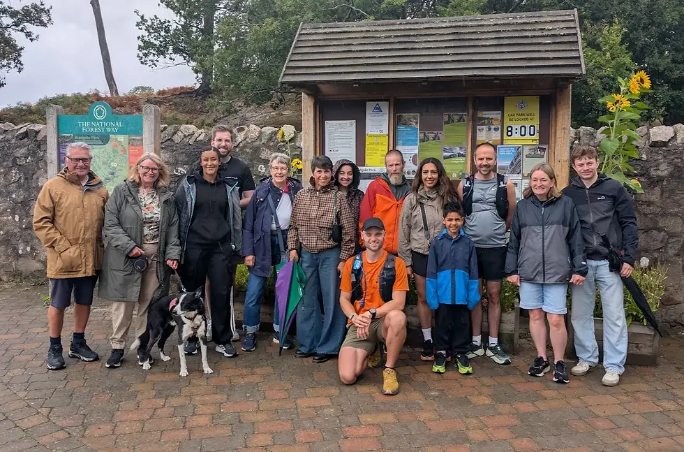 Rob Eberlein with a group of supporters beside a National Forest Way noticeboard