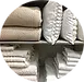 Linge de maison propre et plié (serviettes, draps, coussins), illustrant le service de remplacement à Surgères par LCD Nettoyage.