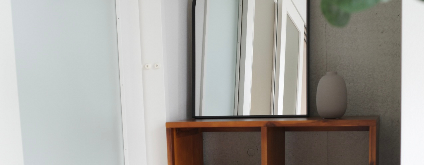 Modern living area with minimalist sofa and natural lighting in a furnished in Tokyo Otsuka Apartment Lohus serviced apartment for expats.