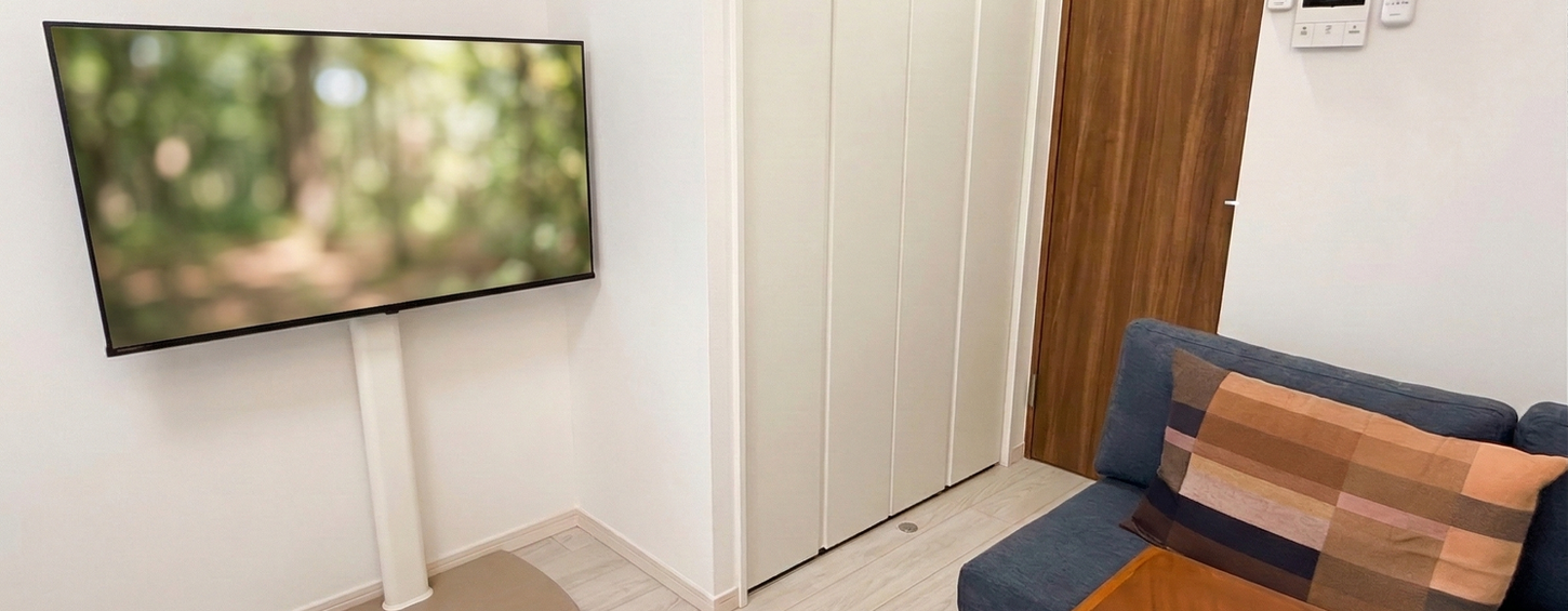 Modern living area with minimalist sofa and natural lighting in a furnished Tokyo uenopark Apartment Lohus serviced apartment for expats.