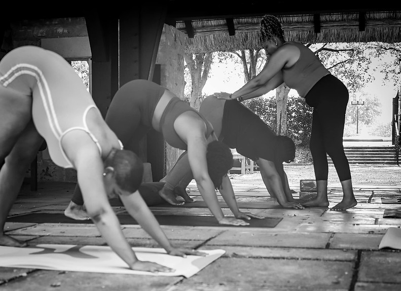 Tiffany Taft guiding a yoga session at Sacred Soul Wellness, promoting wellness and community.