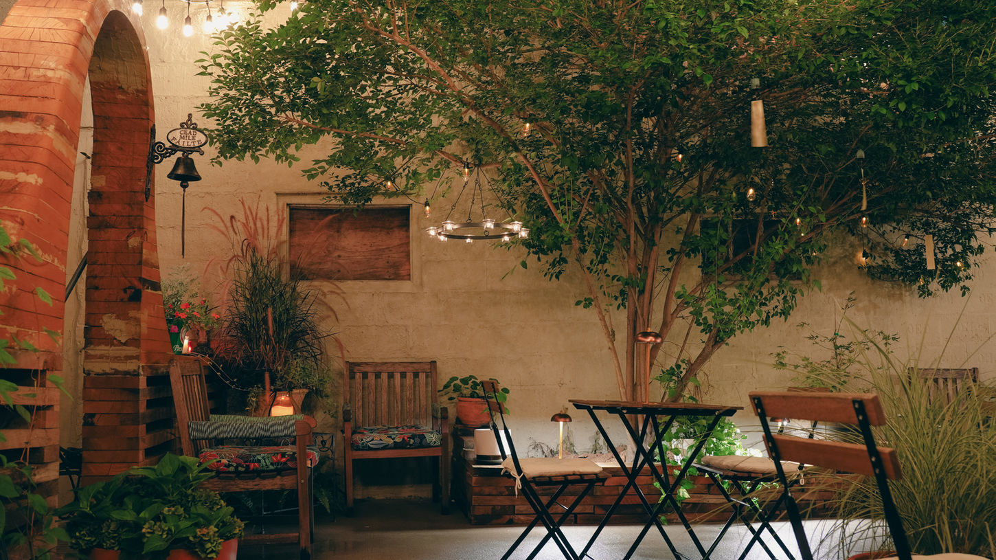 Cafe 9’s cozy outdoor seating area in Astoria, NY, is perfect for enjoying coffee and snacks and hosting intimate events.