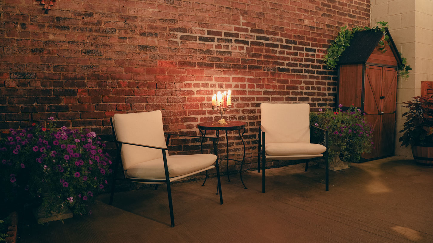 Cafe 9’s cozy outdoor seating area in Astoria, NY, is perfect for enjoying coffee and snacks and hosting intimate events.