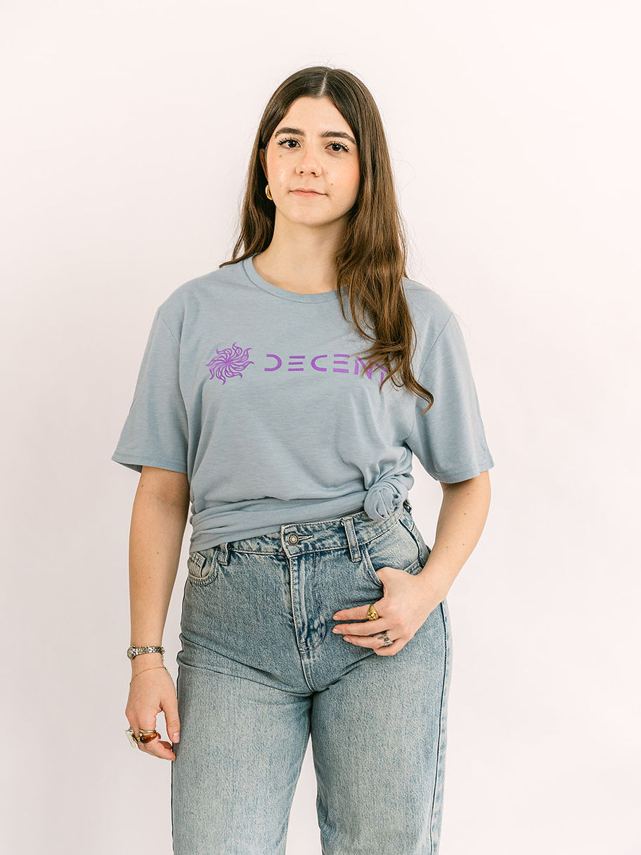 Woman wearing blue t-shirt with purple Decent Threads logo