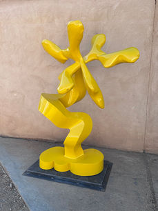 Yellow, 6-foot tall aluminum sculpture by Alex Barrett.