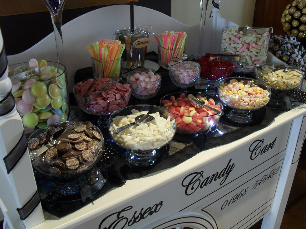 Sweet cart fully stocked with many varieties of sweets on display