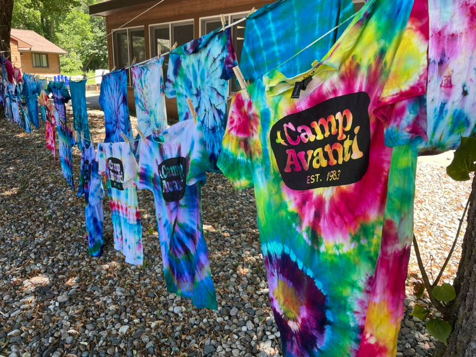 Tie dye shirts hanging on clothesline