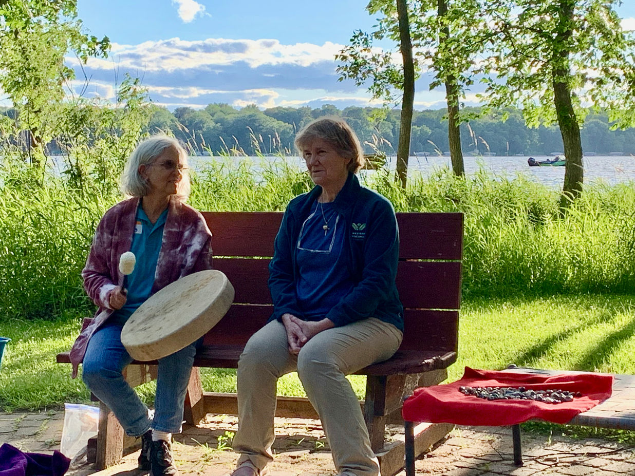 Avanti staff drumming a rhythm for campfire