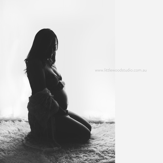 Backlit pregnancy photo black an dwhite
