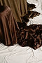 Brown Satin Fabric Draped onto Floor