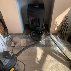 Chimney sweeping and maintenance on a wood burner in staines