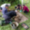 Volunteers digging a test pit.