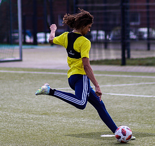 Soccer player kicking a penalty shot