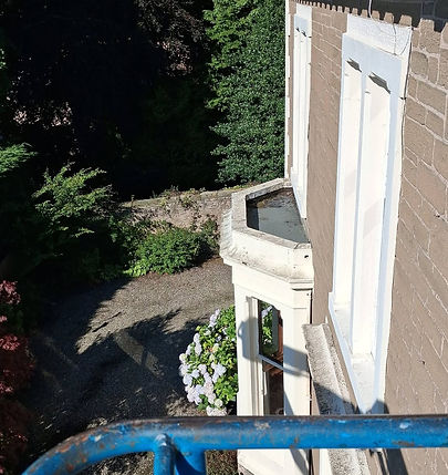 High-angle view from boom lift machine for preparation and painting of exterior eaves and soffits at Ellislea Road, Broughty Ferry by D&G Decorators Dundee