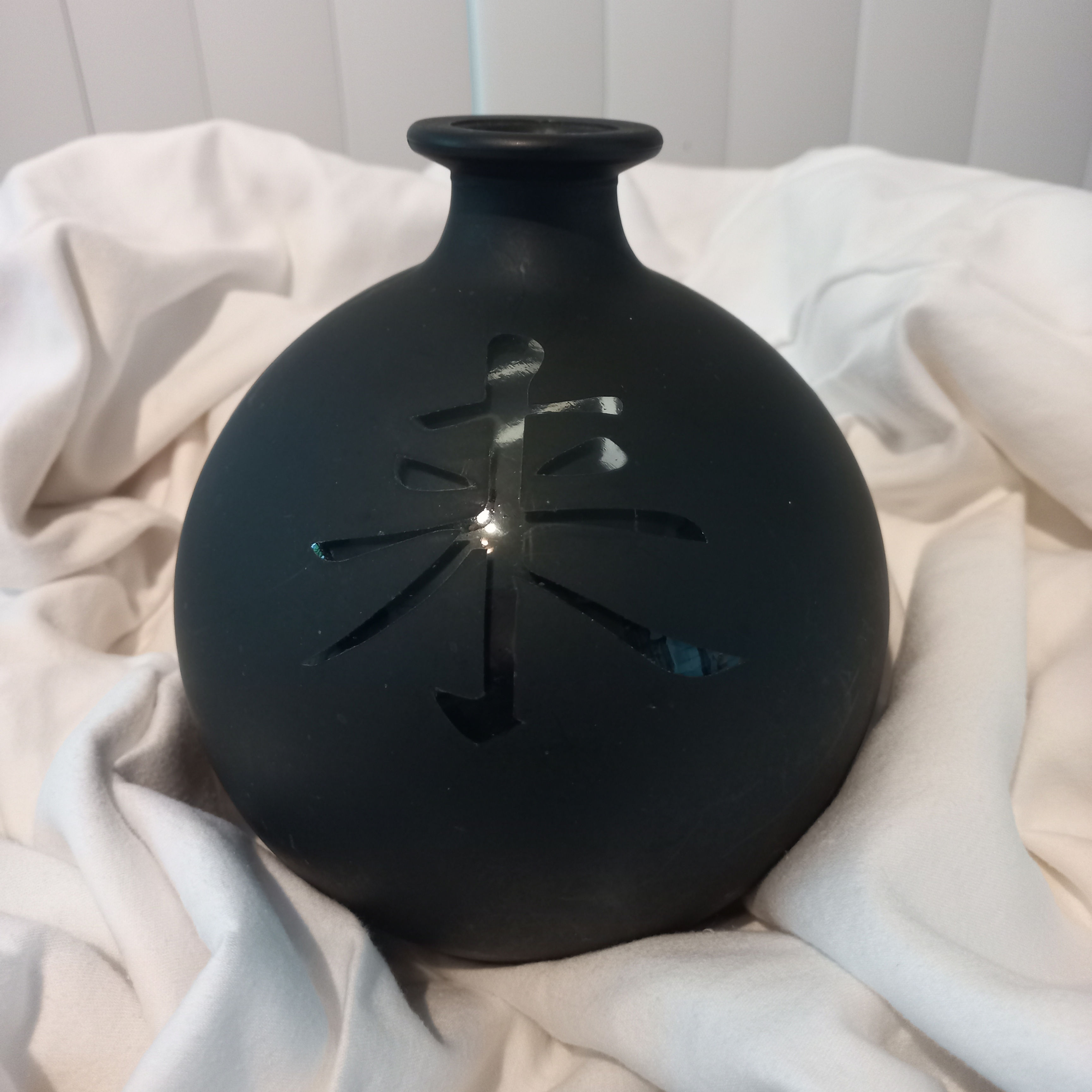 Black glass vase w/Asian script