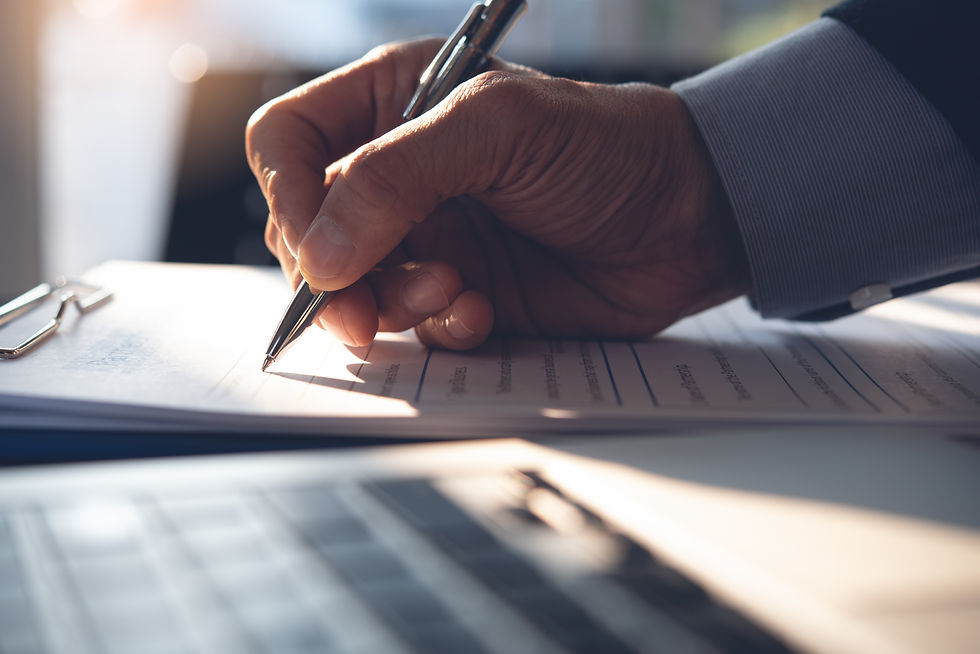 A Member of Personnel Filling Out Documentation.