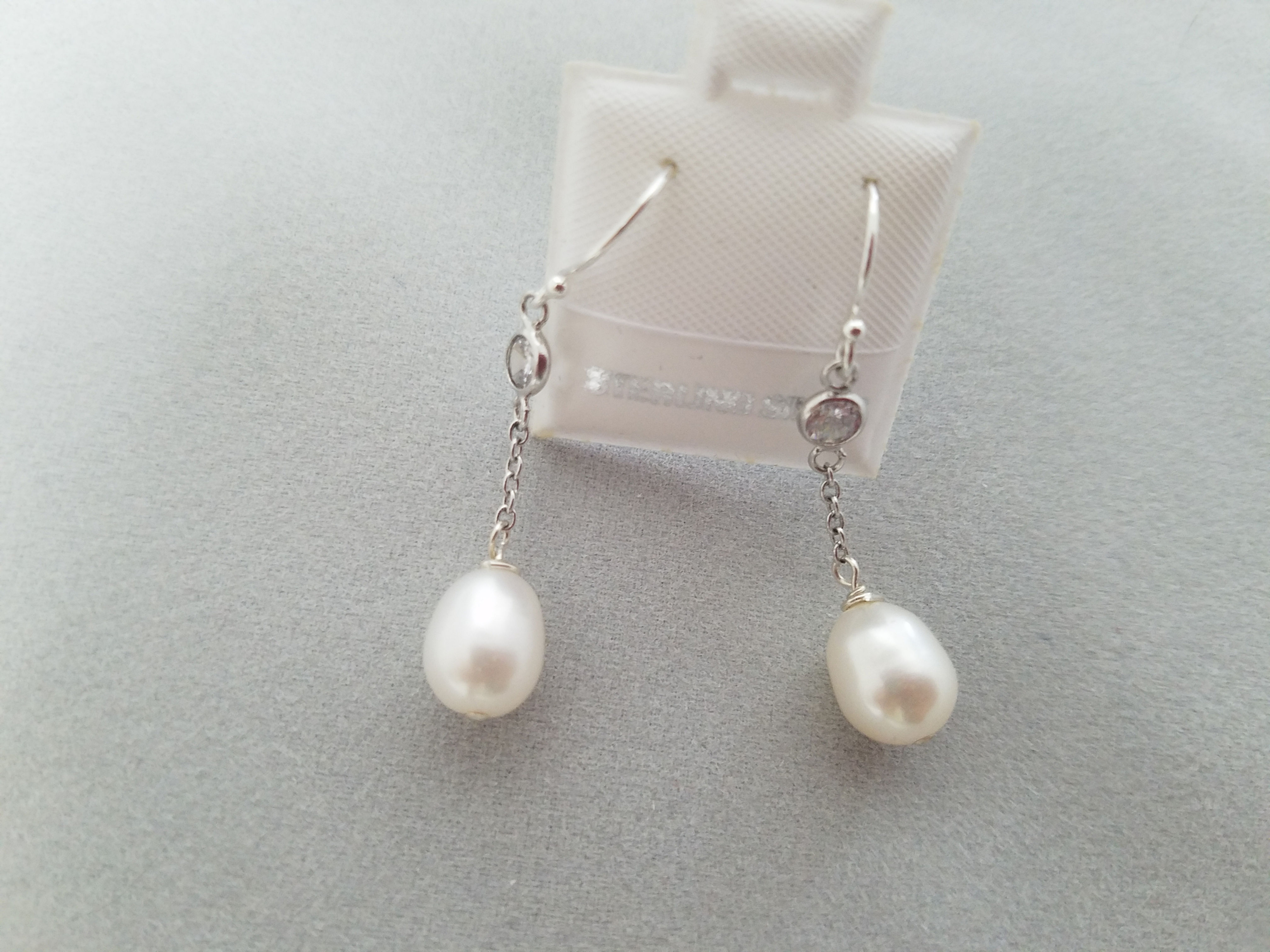 Drop pearls on a chain earrings