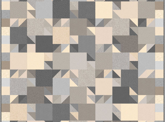 quilt built of squares and triangles in all neutral fabrics.